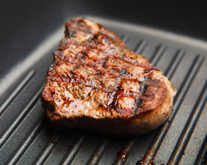 fresh fried steak on a grill pan