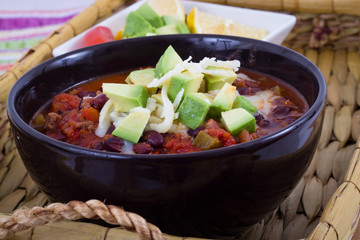 chili con carne bowl with avocado topping