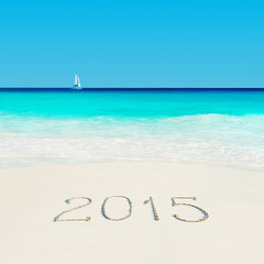 Fototapeta na wymiar Yacht at tropical beach and 2015 sandy caption. Season vacation