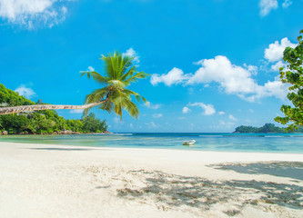 Tropical beach Baie Lazare with boat, Mahe island, Seychelles