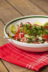 Bowl of Marinated Greek Salad with Red Napkin