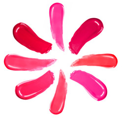 Different lip glosses isolated on white