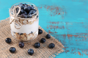 Healthy breakfast - yogurt with  blueberries and muesli served