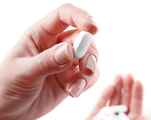 Pills in hand, close-up