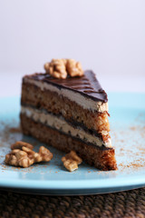 Delicious chocolate cake on plate on table close-up