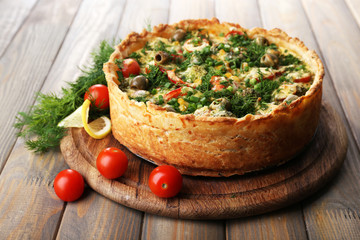 Vegetable pie with broccoli, peas, tomatoes and cheese