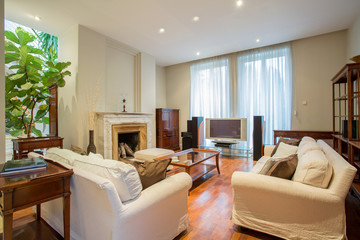 Fototapeta na wymiar Elegant living room with fireplace