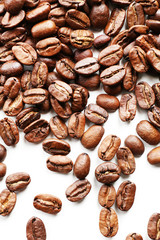 Coffee beans on white table, close-up