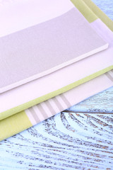 Colorful napkins on wooden table