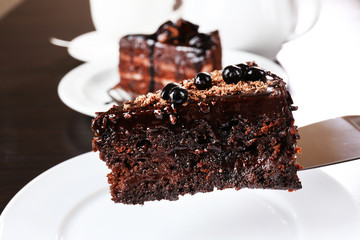 Yummy chocolate cake served on table, close-up