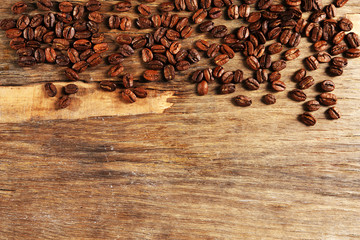Coffee beans on wooden background