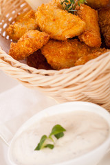 Crumbed chicken nuggets in a basket