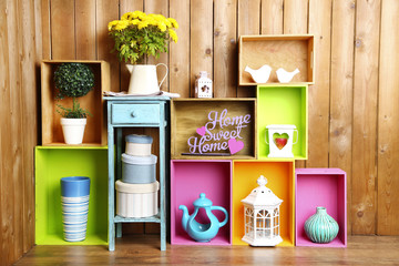 Beautiful colorful shelves with different home related objects