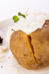 Baked jacket potato with sour cream sauce
