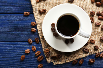 Cup of coffee on wooden table