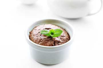 Hot chocolate pudding with fondant centre on white table