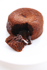 Hot chocolate pudding with fondant centre on plate, close-up