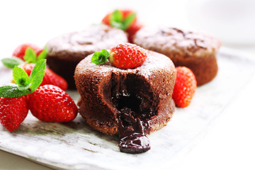 Hot chocolate pudding with fondant centre with strawberries,