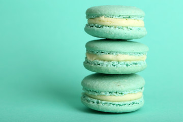 Gentle colorful macaroons on color background