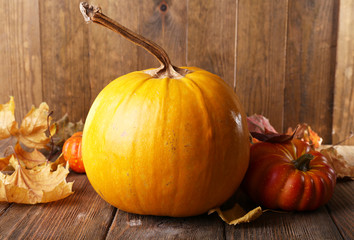 Ripe pumpkin on wooden background