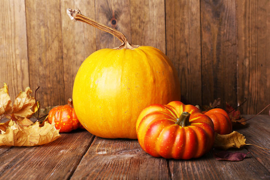 Ripe pumpkin on wooden background