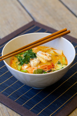 Bowl of traditional Thai tom yam soup