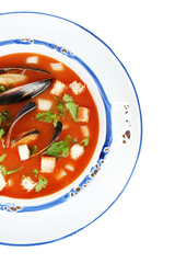 Tasty mussel soup isolated on white