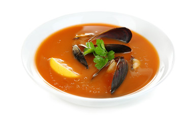 Tasty mussel soup isolated on white