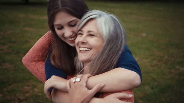 Daughter Surprises Mother With A Loving Hug From Behind