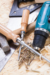 Drill with timber, screwdrivers and screws