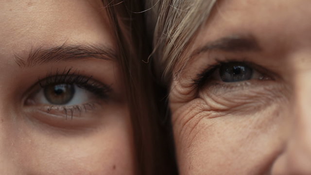 Close Up Of Mother And Daughter Faces Together