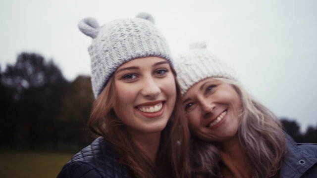 Mother and Daughter Wearing Matching Beanies