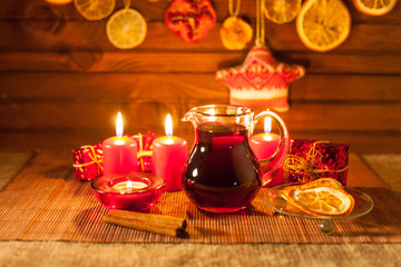Obraz na płótnie Canvas mulled wine and Christmas decorations, candles, gifts