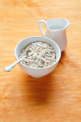 oatmeal in a bowl on wooden boards