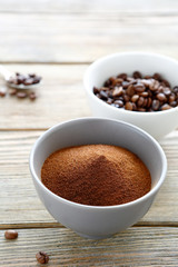 instant coffee powder and Coffee beans in a bowl