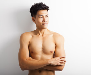Fototapeta premium asian young sport man with perfect fitness body
