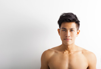 Fototapeta na wymiar asian young sport man with perfect fitness body
