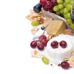 cheeses, red and green grapes, crackers, isolated