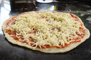 Cheese Pizza fresh on wooden board.