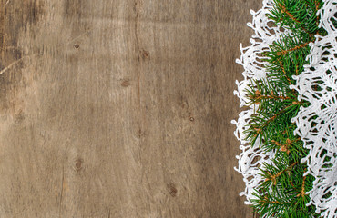 wooden background with space for text with fir branches