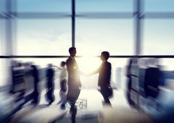 Group of business people and men handshake reflected onto table