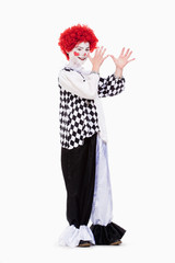 Little Girl in Red Wig Posing as a Clown.