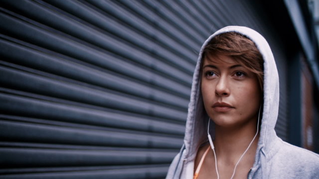 Closeup of determined woman running in 240fps slow motion