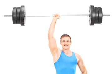 Obraz premium Strong athlete holding a weight in one hand