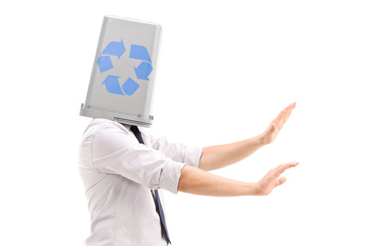 Lost man with a recycle bin over his head