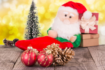 Fototapeta na wymiar Christmas baubles and Santa Claus toy background