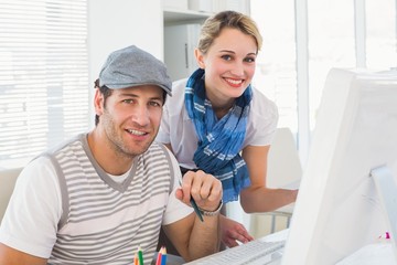 Obraz premium Editorial team working together smiling at camera