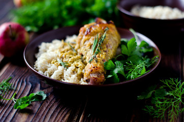Baked chicken leg with rice garnish