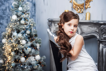 Portrait of the girl near christmas tree