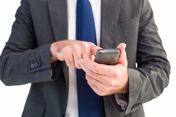 Businessman sending a text message